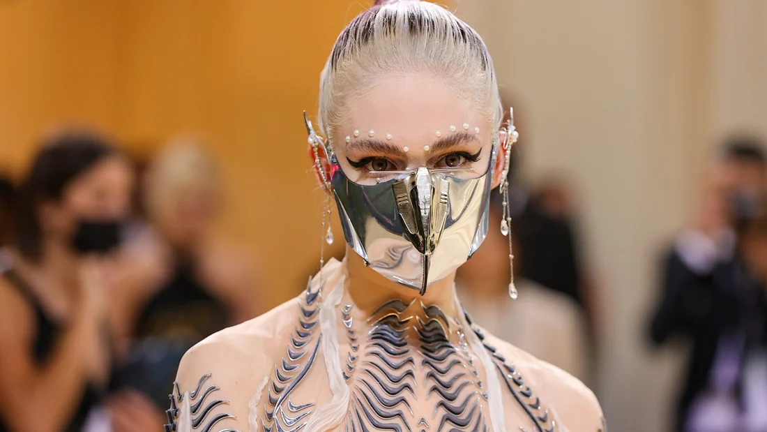 Visual published with the cited source for this record: Grimes offered her voice as a licensed model with a royalty split